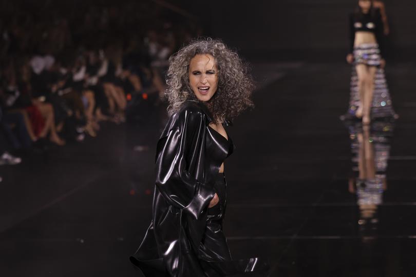 Andie MacDowell wears a creation for the L'Oreal Spring/Summer 2024 womenswear fashion collection presented Sunday, Oct. 1, 2023 in Paris. (AP Photo/Vianney Le Caer)