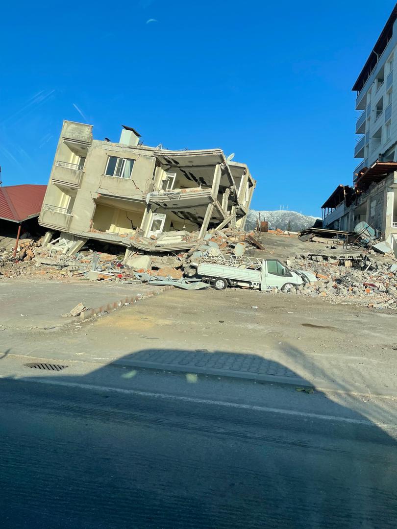 On 14 February 2023, UNICEF staff see the impact caused by the earthquakes to a building as they travel to Sarmada, northwest Syria, to meet local authorities and implementing partners to assess and respond to the needs of communities impacted by the earthquakes. More than one week after two devastating earthquakes and more than 1,600 aftershocks hit south-east Türkiye and Syria – causing widespread destruction and taking the lives of thousands of people. The impact of the earthquakes on the region's children and families has been catastrophic, leaving hundreds of thousands in desperate conditions. Many families have lost their homes and are now living in temporary shelters, often in freezing conditions and with snow and rain adding to their suffering. The earthquakes have also caused widespread damage to schools and other essential infrastructure, further jeopardizing the well-being of children and families. Access to safe water and sanitation is also a major concern, as are the health needs of the affected population. UNICEF has been working around the clock to provide life-saving assistance to those affected by the earthquakes. UNICEF teams on the ground have been working with partners to distribute essential supplies such as critical health supplies, blankets, clothing, and safe drinking water and sanitation supplies, as well as continuing to provide safe spaces for children to play and recover from the traumatic events they have witnessed. Despite these efforts, the needs of the affected population are enormous, and the challenges are many and complex. Damage and destruction of key roads and infrastructure, along with the freezing conditions, snow, and rain have made it difficult to reach those in need and to provide the necessary aid. Many first responders and staff of UNICEF partner organisations have been killed, injured, displaced, and their offices and equipment destroyed, damaged, or out of commission. In the coming days and weeks, UNICEF will continue to work with partners to reach as many children and families as possible with life-saving assistance. Peta Barns