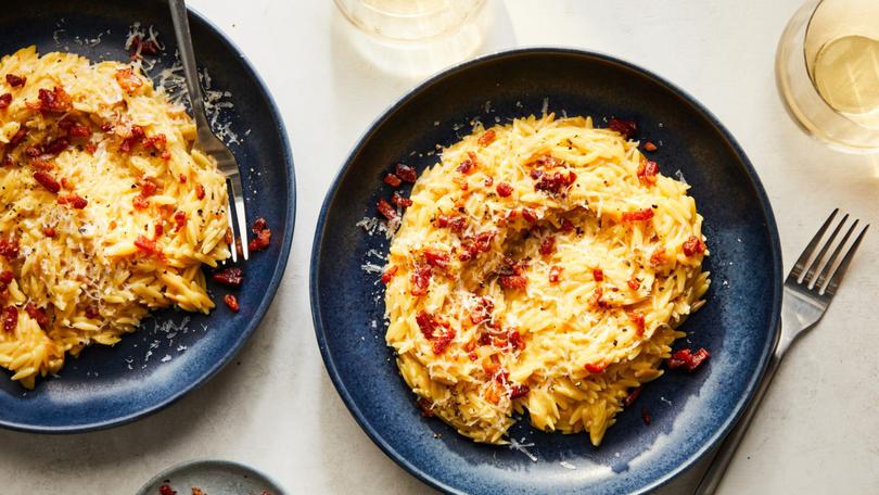 Orzotto alla carbonara. Combining the last-minute simplicity of a carbonara, and the rich-tasting comfort of a long-cooked risotto, this dish is the perfect cold-weather weeknight dinner. Food styled by Barrett Washburne. (Linda Xiao/The New York Times)