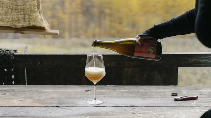 Deirdre Heekin, the owner of the La Garagista winery, pours Fleurine, made from a blend of grapes and apples, in Barnard, Vt., Oct. 26, 2023. 