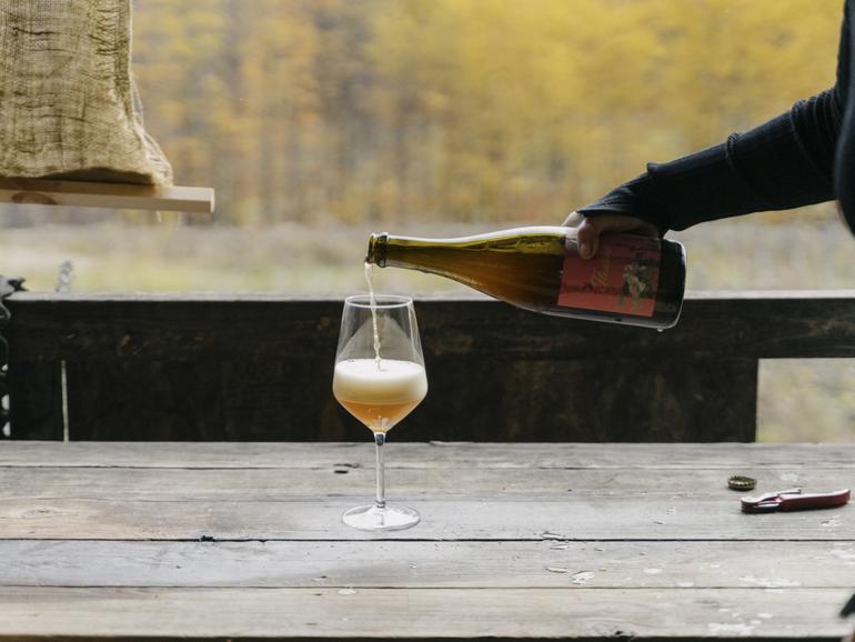 Deirdre Heekin, the owner of the La Garagista winery, pours Fleurine, made from a blend of grapes and apples, in Barnard, Vt., Oct. 26, 2023. 