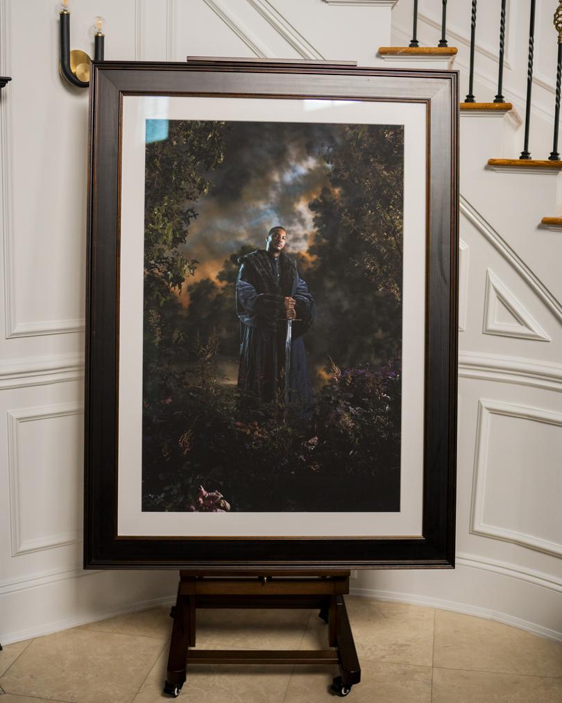A portrait of Carmelo Anthony painted by artist Kehinde Wiley in 2014, at Anthony's home in Westchester, New York, on Oct. 27, 2023. Sports figures are increasingly becoming serious collectors, helping drive interest in contemporary art and particularly in artists of color. (Elias Williams/The New York Times)
