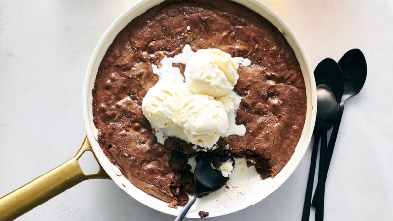 Melissa Clark’s recipe for Easy Skillet Brownies. Mixed and baked in one skillet, you don’t have time for second thoughts. And leaving the brownie in that skillet for serving, instead of cooling and cutting it into neat bars, is an invitation to dig right in. Food Stylist: Simon Andrews (David Malosh/The New York Times)
