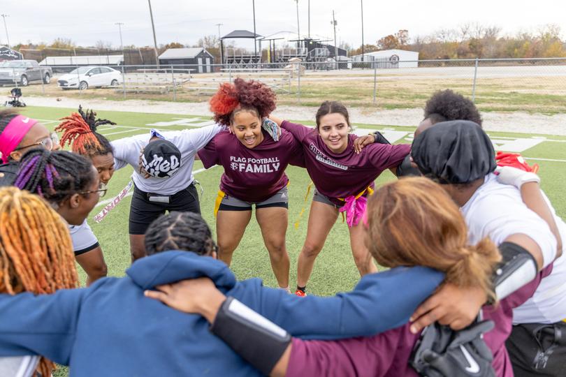Honesty Butler huddles with teammates during flag football practice at Fort Scott Community College in Fort Scott, Kan. 
