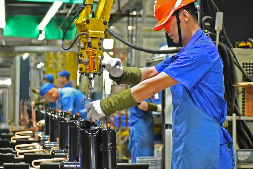 QINGDAO, CHINA - MAY 15, 2023 - A worker makes air conditioners at a workshop of an air conditioner manufacturer in Qingdao, East China's Shandong province, May 15, 2023. (Photo credit should read CFOTO/Future Publishing via Getty Images)