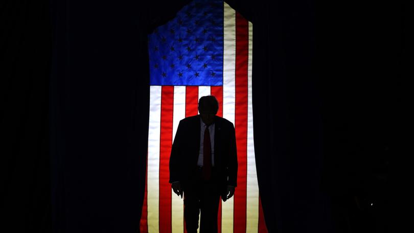 Republican presidential candidate former President Donald Trump steps on stage to at a campaign event in Manchester, N.H., Saturday, Jan. 20, 2024. 