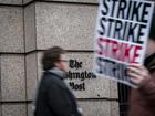 Washington Post staffers picket outside the newspapers headquarters, demanding agreement on a new union contract, on Thursday, Dec. 7, 2023. The 24-hour strike is the first walkout at The Post since the 1970s, union leaders said. (Haiyun Jiang/The New York Times)