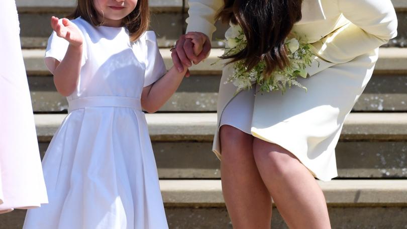 Britain's Catherine (R), Duchess of Cambridge and her daughter Princess Charlotte (L) leave St George's Chapel in Windsor Castle after the royal wedding ceremony of Prince Harry, Duke of Sussex and Meghan, Duchess of Sussex in Windsor, Britain, 19 May 2018. 