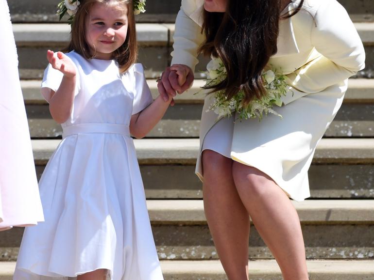 Britain's Catherine (R), Duchess of Cambridge and her daughter Princess Charlotte (L) leave St George's Chapel in Windsor Castle after the royal wedding ceremony of Prince Harry, Duke of Sussex and Meghan, Duchess of Sussex in Windsor, Britain, 19 May 2018. 