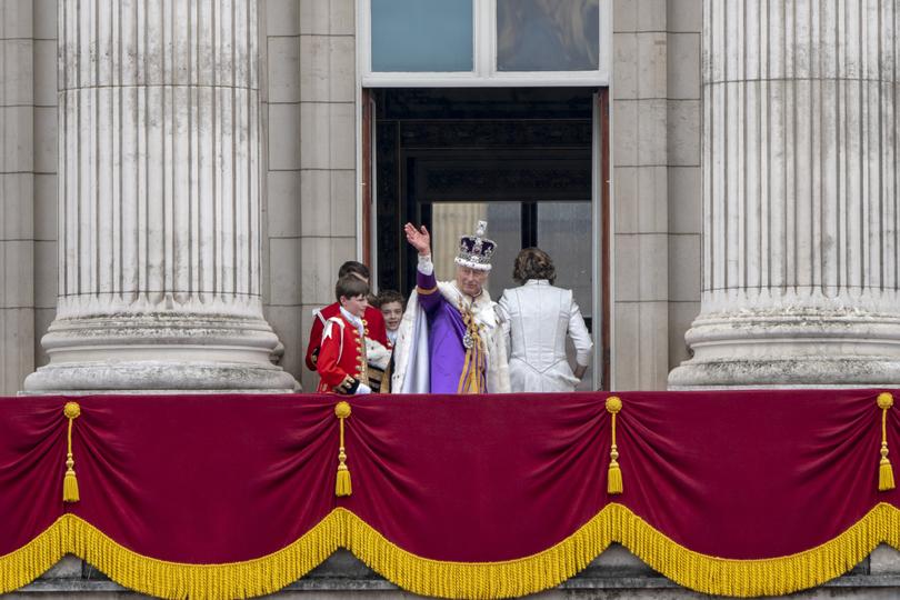 FILE  King Charles III, Queen Camilla and members of the royal family wave from the Buckingham Palace balcony after his coronation in London on May 6, 2023.  They all made us talk: about what we wear, how we live and how we express ourselves. (Andrew Testa/The New York Times)