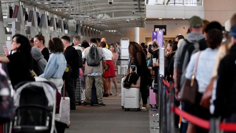 The AFP is cracking down on badly-behaved travellers at airports and on planes this festive season. (Bianca De Marchi/AAP PHOTOS)