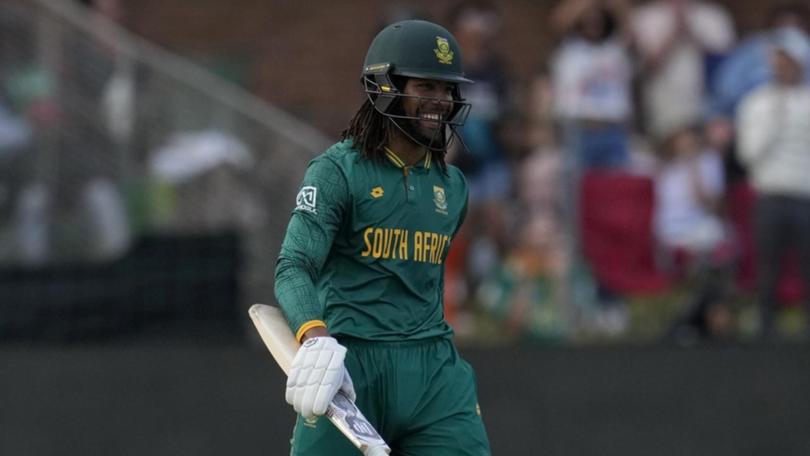 South Africa's Tony de Zorzi is all smiles after reaching 50 against India. (AP PHOTO)