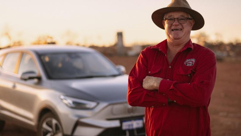 Jeffrey Johnson with his MG ZS EV electric car at his property in Mullewa, Western Australia. (HANDOUT/MG MOTOR AUSTRALIA)