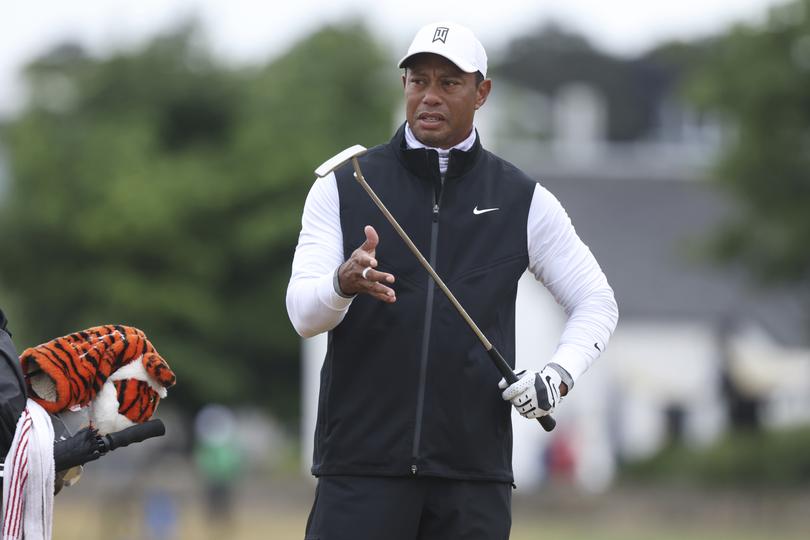 Tiger Woods of the US prepares to play a shot during the second round of the British Open golf championship on the Old Course at St. Andrews, Scotland, Friday July 15, 2022. The Open Championship returns to the home of golf on July 14-17, 2022, to celebrate the 150th edition of the sport's oldest championship, which dates to 1860 and was first played at St. Andrews in 1873. (AP Photo/Peter Morrison)