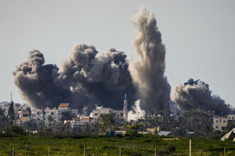 Smoke and explosion following an Israeli bombardment inside the Gaza Strip, as seen from southern Israel, Sunday, Feb. 11, 2024. The army is battling Palestinian militants across Gaza in the war ignited by Hamas' Oct. 7 attack into Israel. (AP Photo/Ariel Schalit)