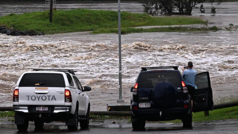 Queenslanders hit by floods will have access to a $50 million federal government support package. (Dave Hunt/AAP PHOTOS)