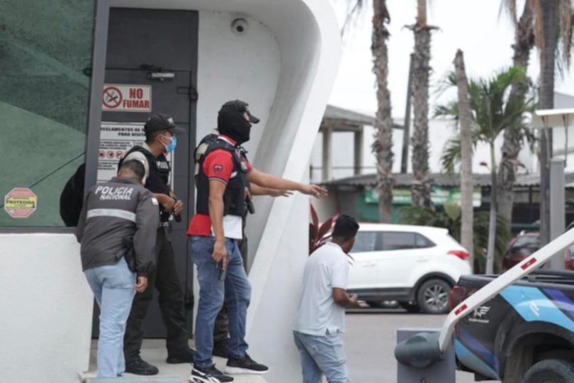 Police respond to an attack at the TC Television network, a public television channel in Guayaquil, Ecuador, Tuesday, Jan. 9, 2024. Masked men broke onto the set waving guns and explosives during a live broadcast Tuesday. (AP Photo/Cesar Munoz)