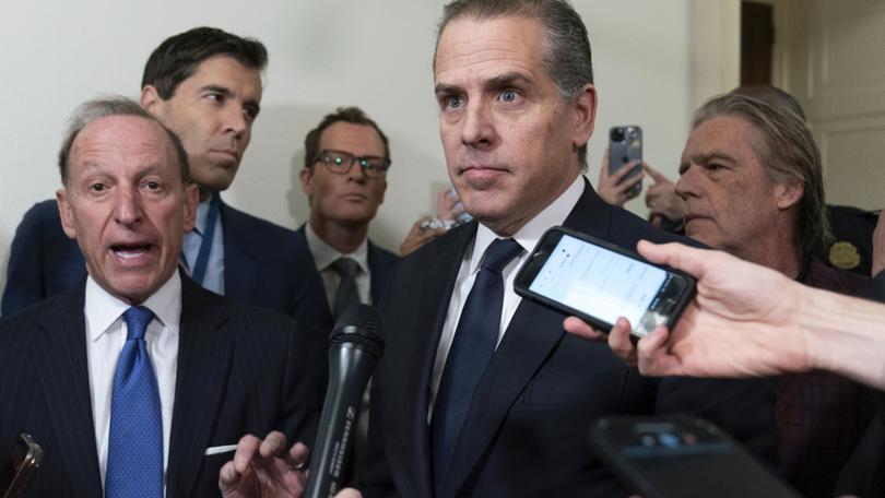 Hunter Biden, President Joe Biden's son, accompanied by his attorney Abbe Lowell, left, talks to reporters as they leave a House Oversight Committee hearing as Republicans are taking the first step toward holding him in contempt of Congress, Wednesday, Jan. 10, 2024, on Capitol Hill in Washington.  (AP Photo/Jose Luis Magana)