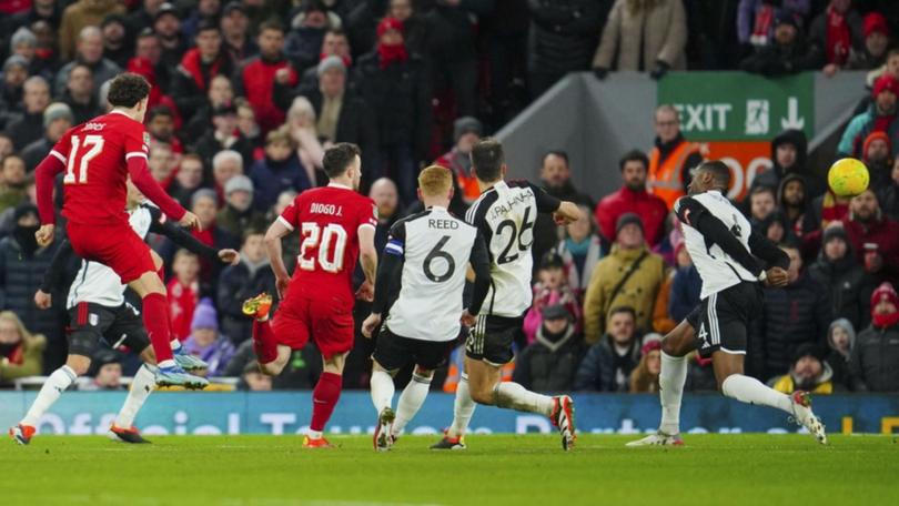 Curtis Jones (l) scores for Liverpool in their League Cup semi first leg 2-1 win over Fulham. (AP PHOTO)