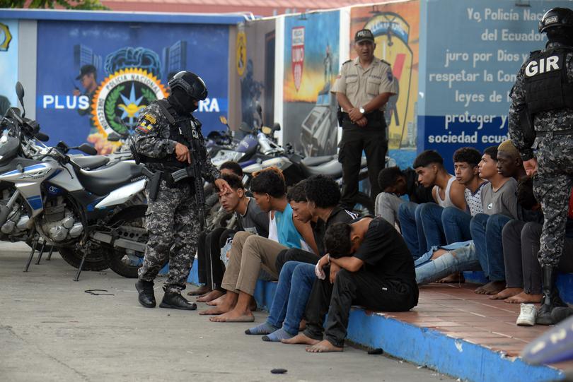 GUAYAQUIL, ECUADOR - JANUARY 10: Police present detainees in the case of TC Televisión on January 10, 2024 in Guayaquil, Ecuador. President Noboa declared "internal armed conflict" after hooded and armed men broke into TC Television's live broadcast, among other violent incidents across the country on Tuesday. Ecuador has been hit by explosions, police kidnappings, and prison disturbances since Noboa on Monday declared a nationwide state of emergency after gang leader Adolfo "Fito" Macias escaped from a prison in Guayaquil. (Photo by Romina Duarte/Getty Images)