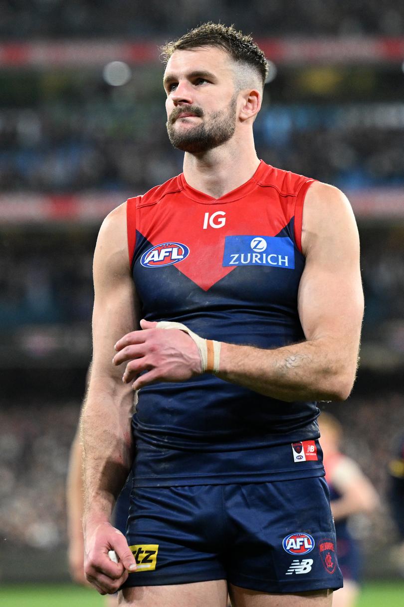 Joel Smith of the Demons exits the field after being defeated by the Carlton Blues in the AFL Semi-final between the Melbourne Demons and Carlton Blues at the MCG in Melbourne, Friday, September 15, 2023. (AAP Image/James Ross) NO ARCHIVING, EDITORIAL USE ONLY