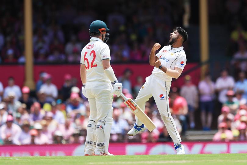 Aamir Jamal of Pakistan celebrates the wicket of Travis Head of Australia on Jane McGrath Day during day three of the Men's Third Test Match in the series between Australia and Pakistan at Sydney Cricket Ground on January 05, 2024.