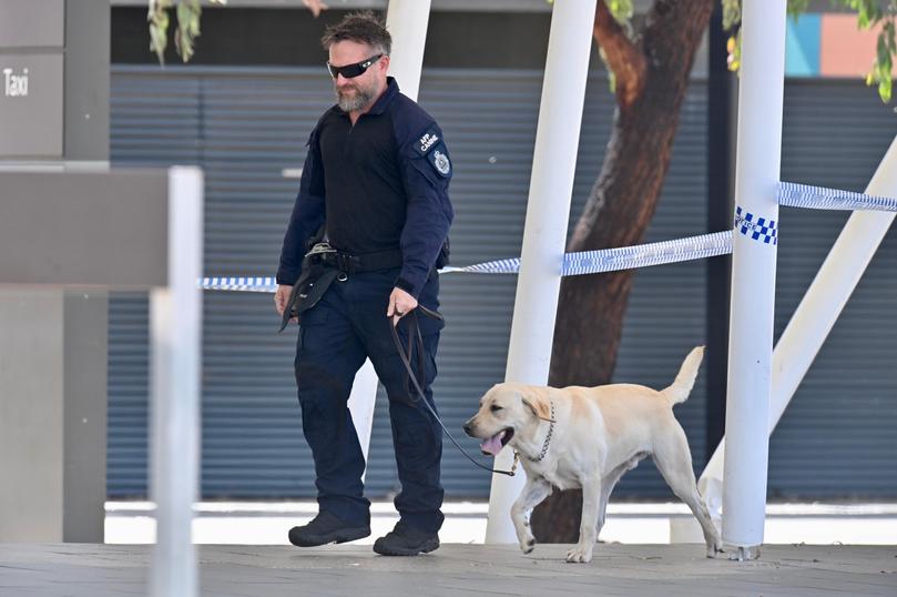 An area of Perth Airport between terminals 1 and 2 was closed off as the AFP and WA Police officers searched the area.