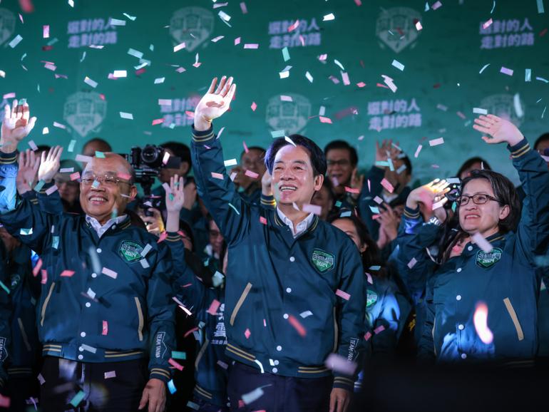 Taiwan's Vice President and presidential-elect from the Democratic Progressive Party (DPP) Lai Ching-te (C) and his running mate Hsiao Bi-khim (Centre R).