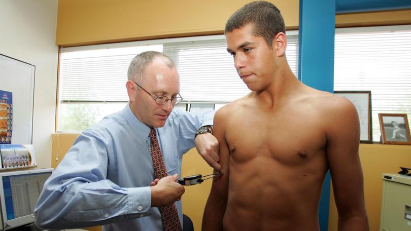 A young Lance Franklin get his skinfolds tested in 2004.