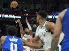 Damian Lillard puts up the game-winning 3-pointer during overtime for Milwaukee against Sacramento. (AP PHOTO)