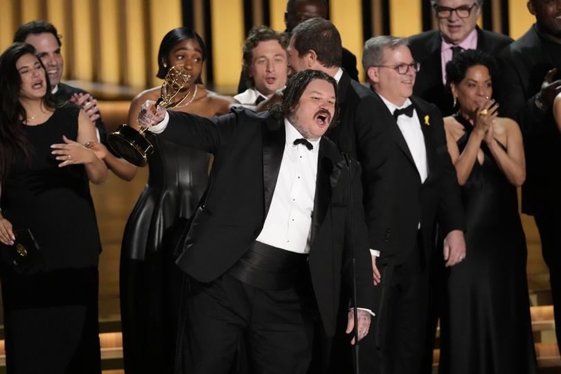 Matty Matheson, center, and the team from "The Bear" accept the award for outstanding comedy series during the 75th Primetime Emmy Awards on Monday, Jan. 15, 2024, at the Peacock Theater in Los Angeles. (AP Photo/Chris Pizzello)