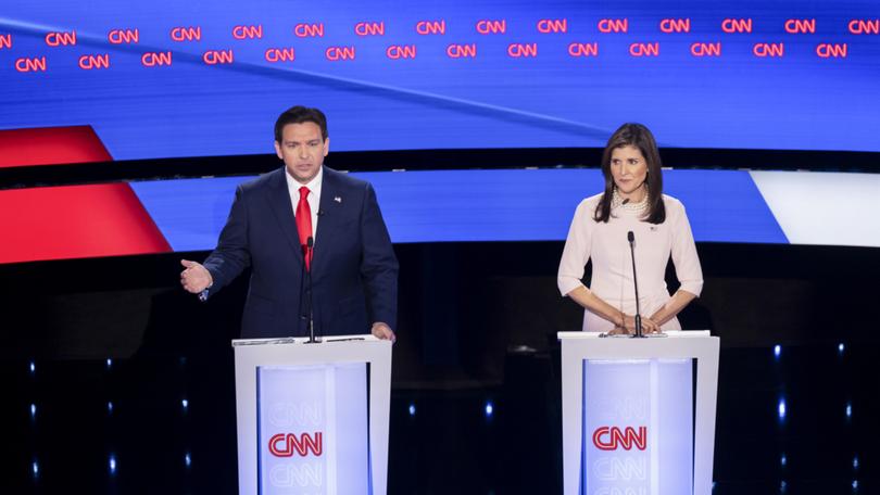 Nikki Haley, the former governor of South Carolina, listens as Florida Gov. Ron DeSantis speaks during the fifth Republican presidential debate.