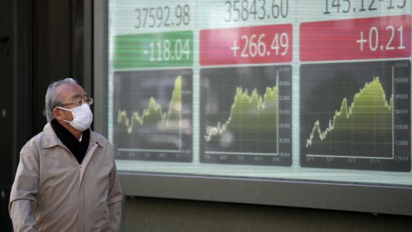 Jpan's Nikkei looks set to snap a sharp six-session winning streak with a 0.7 per cent dip. (AP PHOTO)