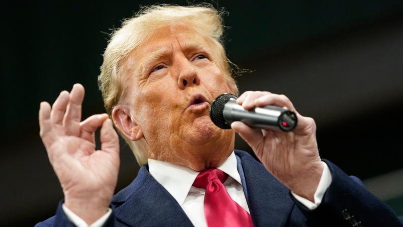 Former US President Donald Trump speaks during the 2024 Iowa Republican caucuses at Horizon Events Center in West Des Moines, Iowa, US, on Monday, Jan. 15, 2024. Trump cruised to victory in the Iowa caucus, according to news outlets, warding off a late challenge from rivals DeSantis and Haley and cementing his status as the clear Republican frontrunner in the race. Photographer: Nathan Howard/Bloomberg