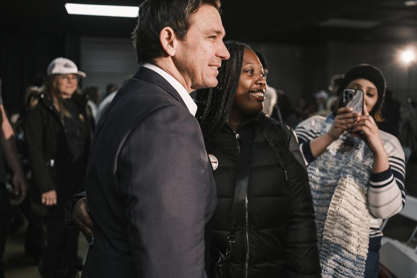 Florida Gov. Ron DeSantis, a Republican presidential candidate, greets attendees during a campaign event in Council Bluffs, Iowa, on Saturday, Jan. 13, 2024. 