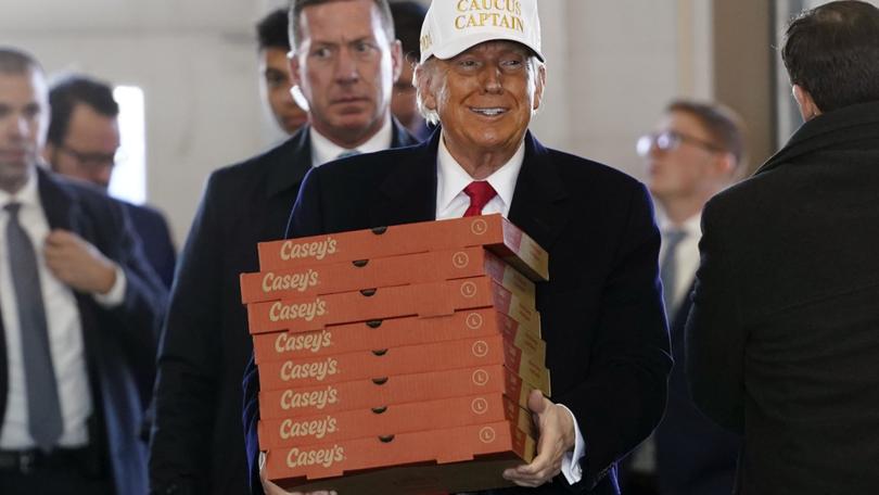 Republican presidential candidate former President Donald Trump arrives to deliver pizza to fire fighters at Waukee Fire Department.