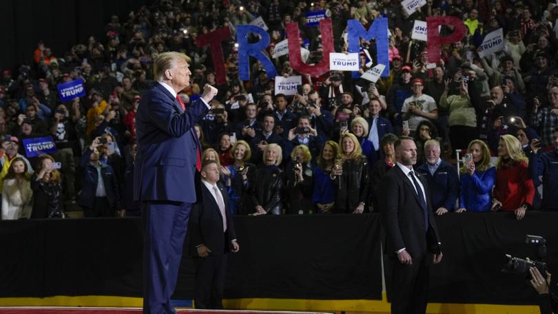 Republican presidential candidate former President Donald Trump gestures to the crowd during a campaign event in Manchester, N.H., Saturday, Jan. 20, 2024. (AP Photo/Matt Rourke)