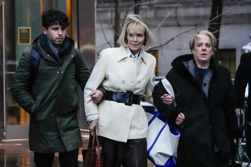 E. Jean Carroll, centre, leaves Manhattan federal court following her defamation trial against former President Donald Trump.