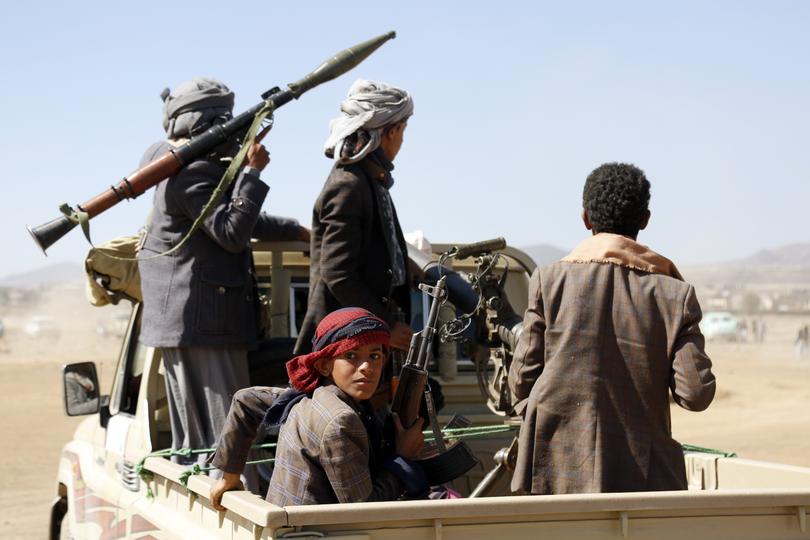 Houthi fighters and tribesmen stage a rally against the U.S. and the U.K. strikes on Houthi-run military sites near Sanaa, Yemen, on Sunday, Jan. 14, 2024. (AP Photo)