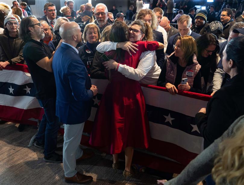 Former Govl Nikki Haley of South Carolina, back to camera, is embraced by a supporter in West Des Moines following her third-place finish in the Iowa caucuses on Monday night, Jan. 15, 2024. Haley will move next to New Hampshire, whose more moderate electorate is expected to provide her with friendlier terrain. (Ruth Fremson/ The New York Times)