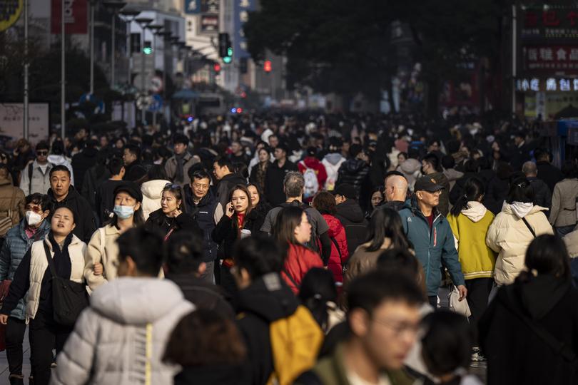 A throng of pedestrians in a busy shopping area of Shanghai, China, Jan. 13, 2024. 