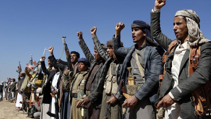 Houthi fighters and tribesmen stage a rally against the U.S. and the U.K. strikes on Houthi-run military sites near Sanaa, Yemen, on Sunday, Jan. 14, 2024.