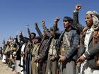 Houthi fighters and tribesmen stage a rally against the U.S. and the U.K. strikes on Houthi-run military sites near Sanaa, Yemen, on Sunday, Jan. 14, 2024.