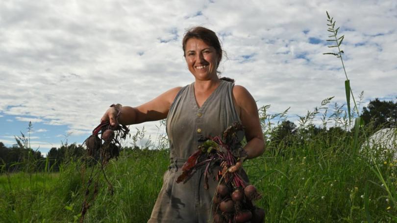 Tanya Senior swapped life as a public servant for getting her hands dirty in a market garden. (Mick Tsikas/AAP PHOTOS)