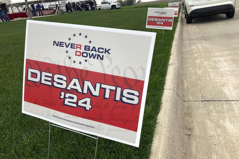 FILE - Yard signs promoting Florida Gov. Ron DeSantis in 2024, financed by the super PAC promoting DeSantis for president, line the street leading up to a Republican congressional fundraiser, May 13. 2023, in Sioux Center, Iowa. DeSantis has suspended his Republican presidential campaign after a disappointing showing in Iowa's leadoff caucuses. He ended his White House bid Sunday, Jan. 21, 2024, after failing to meet lofty expectations that he would seriously challenge former President Donald Trump. (AP Photo/Tom Beaumont, File)