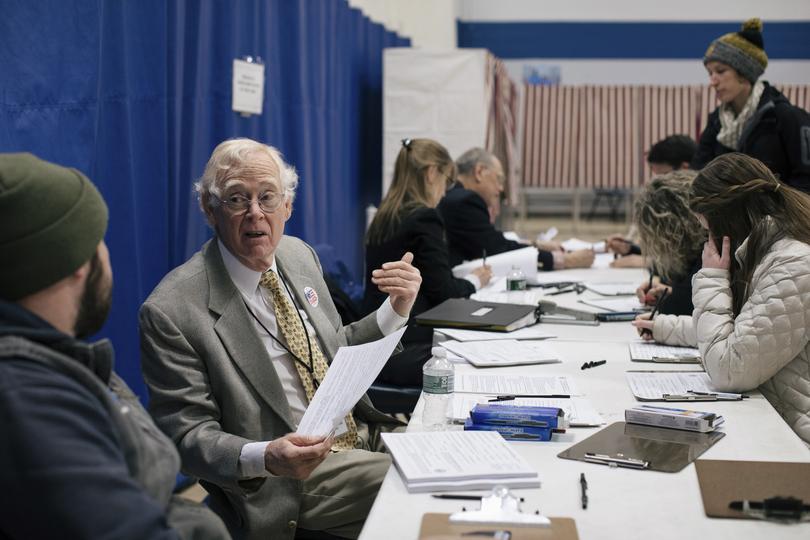 Voters getting checked during the primary election at a polling site in Concord, New Hampshire., on February 11, 2020. (Alyssa Schukar/The New York Times)