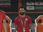 Egypt's injured player Mohamed Salah, centre, watches his team mates warm up before the African Cup of Nations Group B soccer match between Cape Verde and Egypt. (AP Photo/Themba Hadebe)