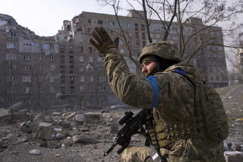 FILE - A Ukrainian serviceman guards his position in Mariupol, Ukraine, March 12, 2022. The image is part of the documentary film "20 Days in Mariupol," which has been nominated for best documentary at the Academy Awards. (AP Photo/Mstyslav Chernov, File)