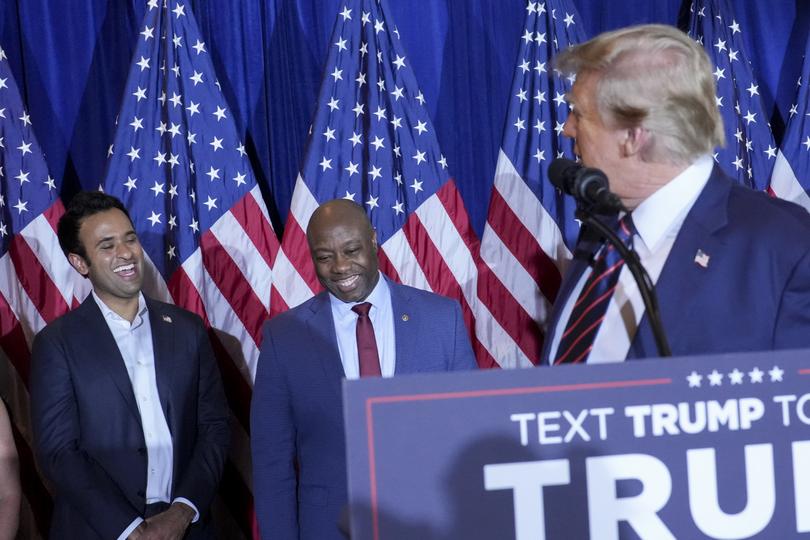 Vivek Ramaswamy and Senator Tim Scott listen as former President Donald Trump speaks during his watch party. (Doug Mills/The New York Times)