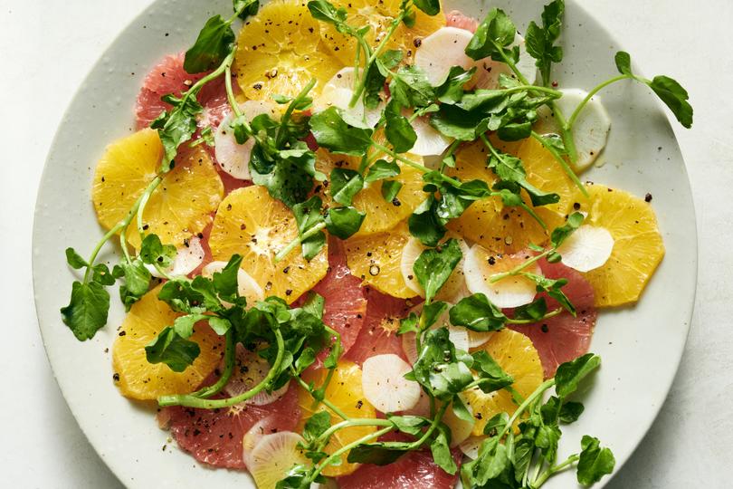 A citrus salad with radish and watercress.